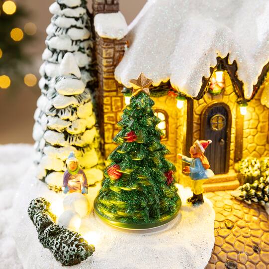 Glitzhome® 9.5" Lighted Christmas Snowy Musical Resin Village with Movement and Timer